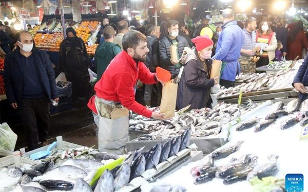 A fishmonger works at a market in Ankara, Turkey