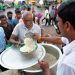 People get food from a social worker during the World Food Safety  Day in Agartala, the capital city of India’s northeastern state of Tripura